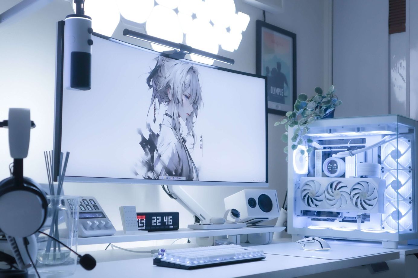 A clean workspace featuring high-performance gaming hardware and consoles